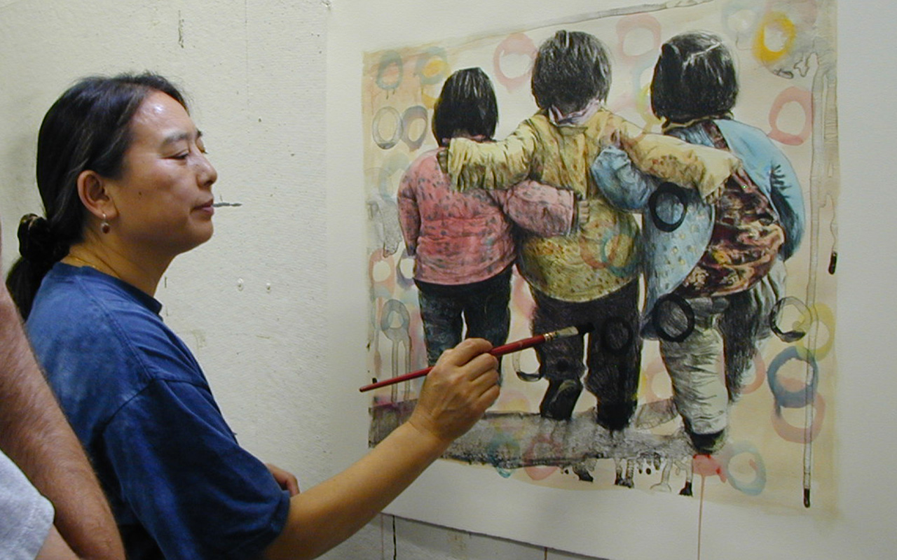 Hung Liu painting on monotype.