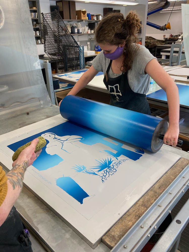 Tamarind Student Printer Lindsey Sigmon rolls a blend roll for the edition created by Gaby Hernández.