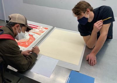 Tamarind Student Printer Austin Armstrong with Tipping Points artist Eric Garcia